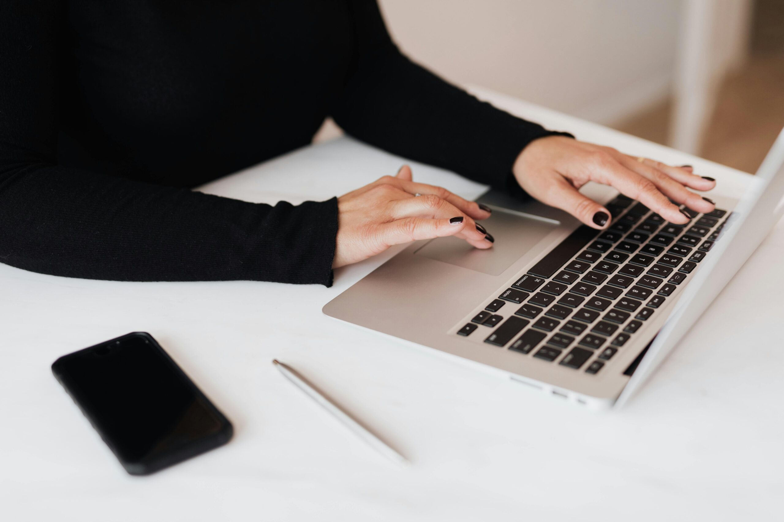 women in small business typing on computer